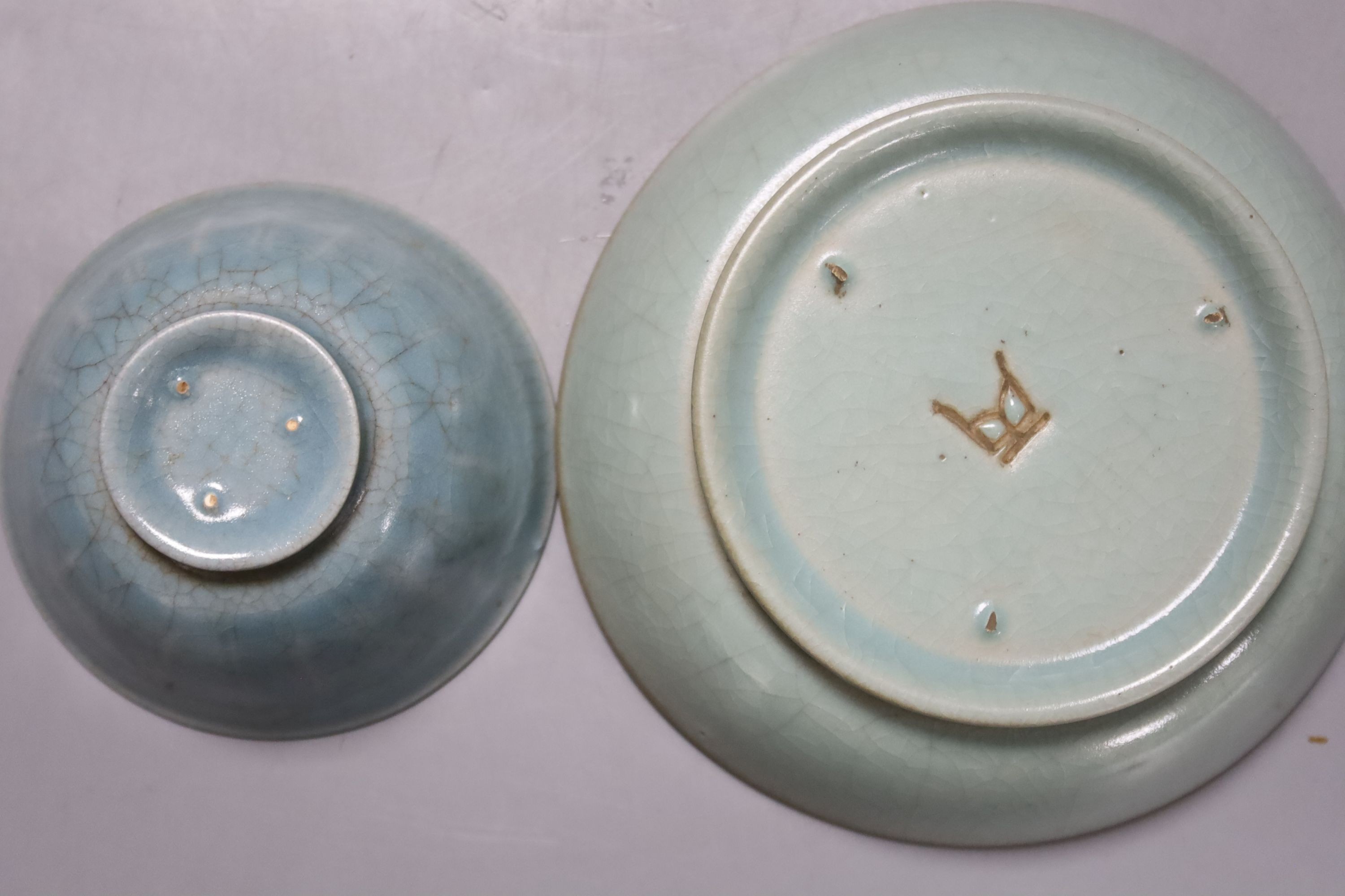 A Chinese celadon bowl and a teabowl, diameter 15cm